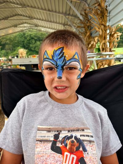 Boy with a blue wolf mask full face design, face painting by In His Image, Morristown TN