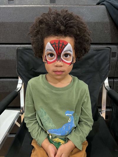 Boy with a red Spider-Man style mask full face design, face painting by In His Image, Morristown TN