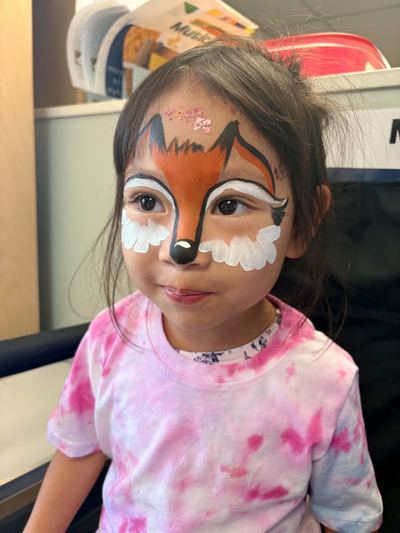 Girl with an orange fox full face design, face painting by In His Image, Morristown TN